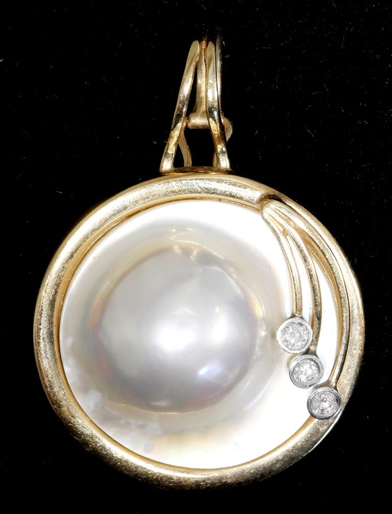 Gold, Diamond & Mother Of Pearl Pendant: Art Nouveau style round pendant with 14K gold frame with three small diamonds, 9.1 grams total gross weight