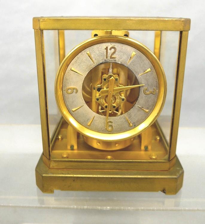 Vintage Lecoutre Atmos Clock: Vintage Lecoutre Atmos clock, gold gilt brass and glass case, perpetual atmospheric movement, serial number 40949 circa early 1950's, 8.25"W, 9.25"H, 6.25"D