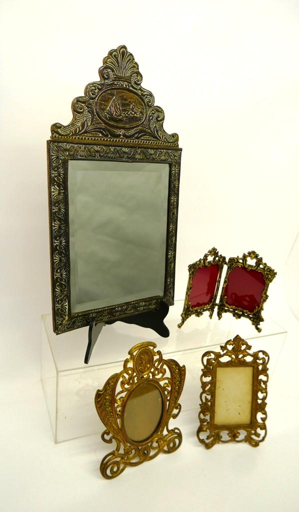 Antique to Contemporary Small Mirrors: Vintage Dutch repousse brass mirror on wood backing with beveled glass mirror 12" by 21.5", antique painted cast iron easel back frame with acanthus leaf decoration 6.5" by 10", 19th century oval meda