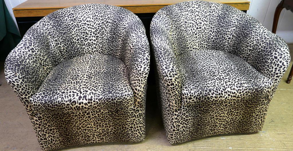 Four Leopard Skin Club Chairs: Set of four matching club chairs on wheels upholstered in leopard pattern fabric 30"H