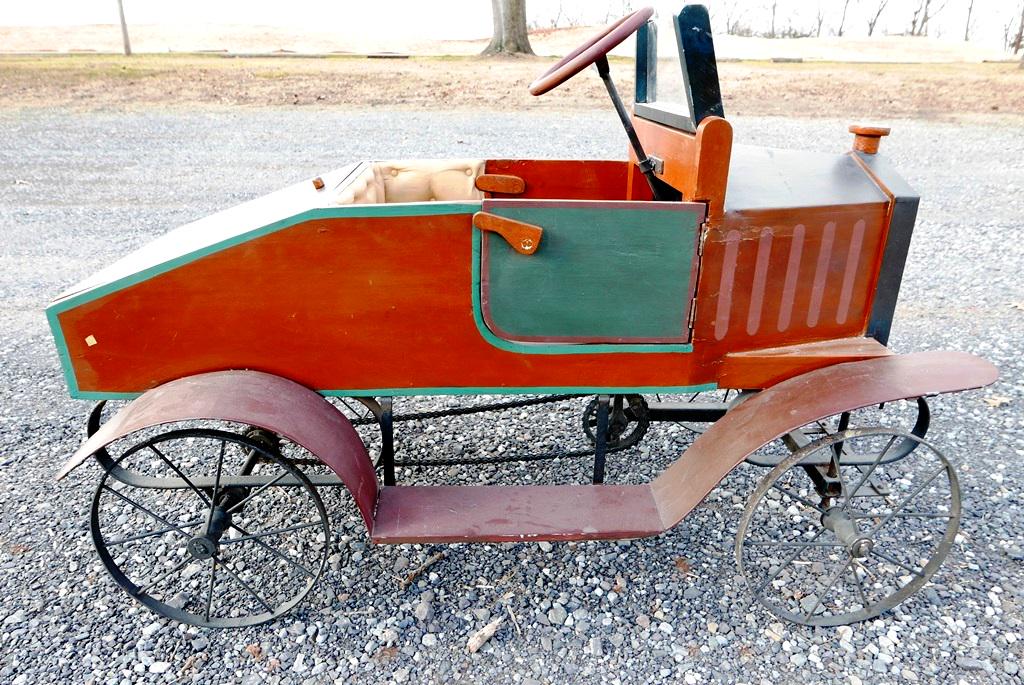Old Time Style Pedal Car: Contemporary folksy pedal car, metal fenders, running boards, wheels and suspension with pedals and bicycle chain drive, painted wood body with opening doors and rumble seat, hand painted landscape on