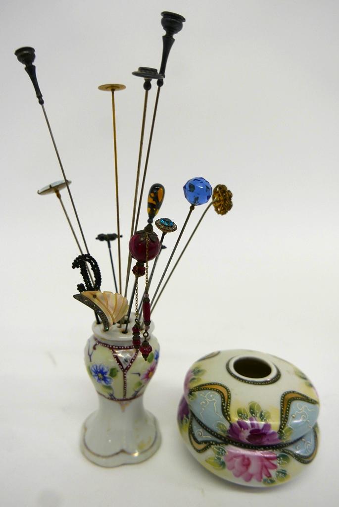 14 Antique Hat Pins, Stand & Hair Holder: Antique Nippon hand painted hat pin stand 4"H and a similar two piece hair receiver box 4"D, pin with oval portrait on porcelain, amber glass with silver overlay, 4 Pottstown pins from The Hill School