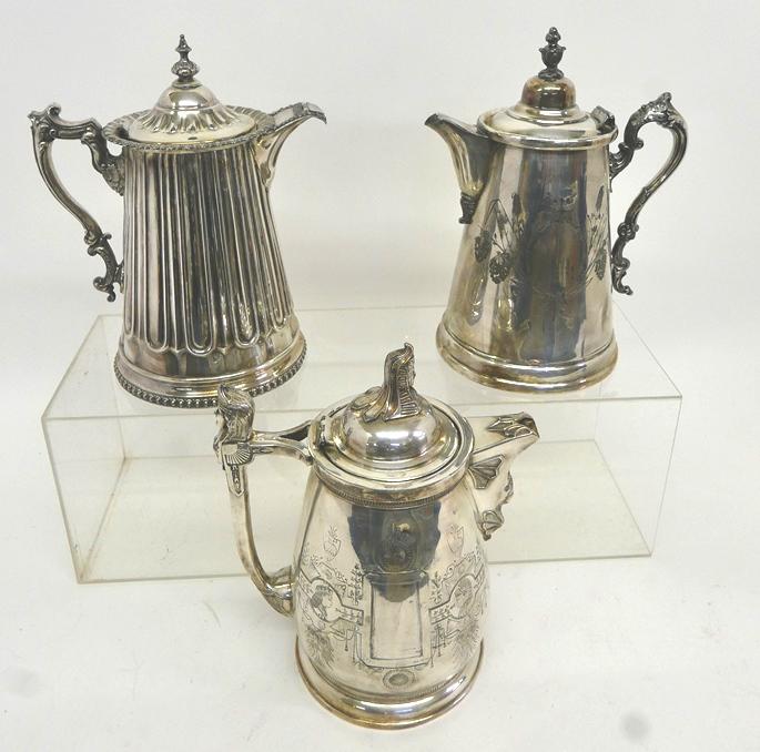 Three 19th Century Ornate Water Pitchers: Ornate Egyptian Revival water pitcher with figural handle, lid and spout, also has Renaissance and Native American themed decorations 13"H with normal wear and dents, Stimpson 1850's silver plate pitc