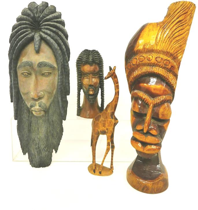 African Carved Wood Sculptures: Large African carved bust with headdress 28.5"H, carved bust with dreads 12.5"H, carved face plaque 29"H, Kenya carved giraffe 18"H