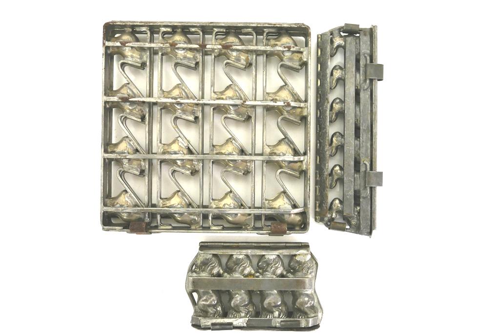 Horse, Chick & Rabbit Chocolate Molds: Three antique plated steel chocolate molds, mold for 16 chicks 10.5" square, mold for 6 sitting rabbits 11"L signed Germany, mold for 4 standing horses 7"L signed Bortz