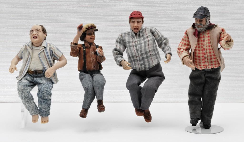 Four Artisan Dollhouse Character Dolls one Carrington: Four hand made artisan clay character dollhouse dolls, three sitting and one standing, tallest 5.5"H The standing figure with metal stand on the far right is the Carrington Doll , per consignor she ha