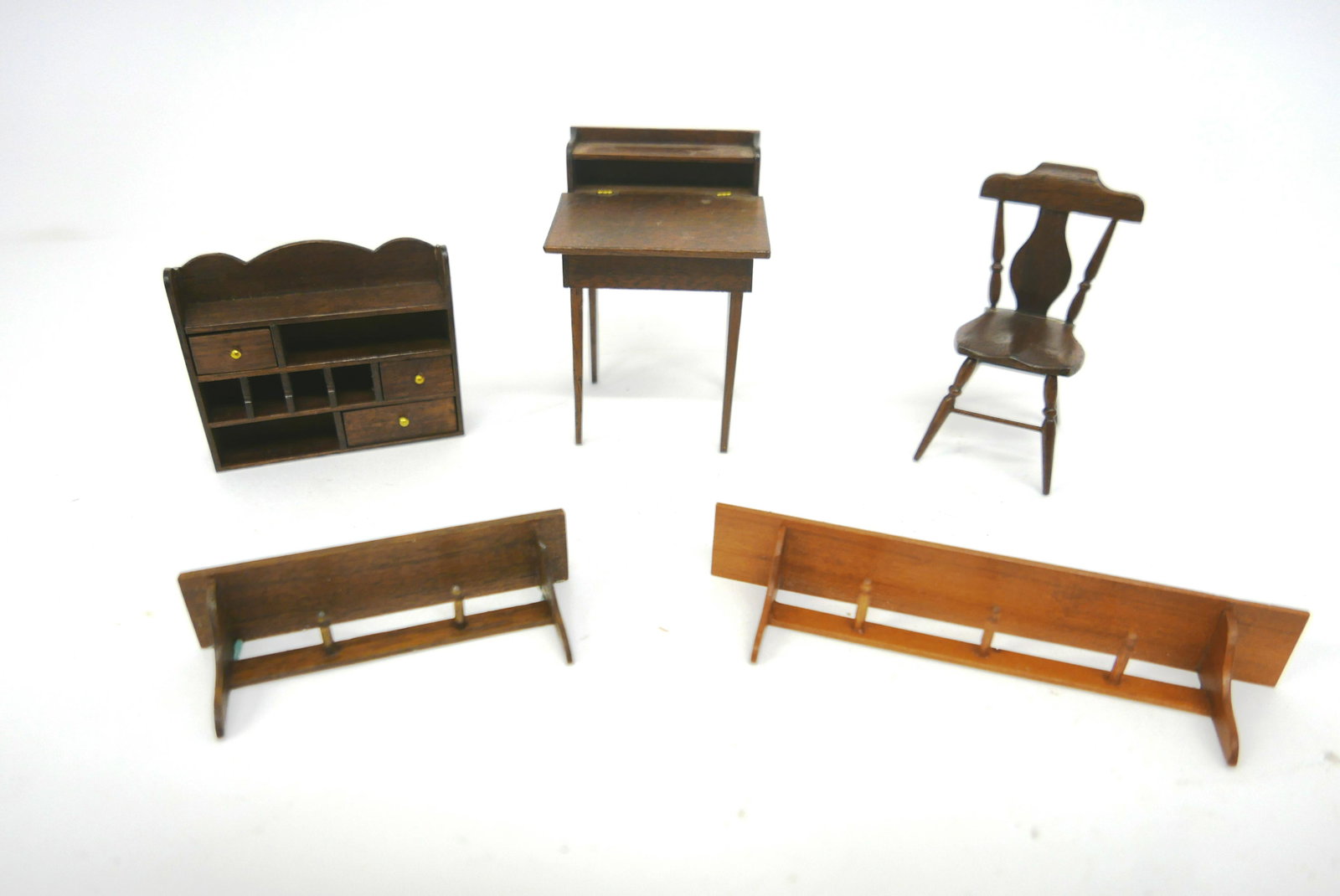 William Kemp Artisan Dollhouse Furniture: Five pieces of signed William Kemp artisan mahogany furniture, teacher or book keeper style desk with hinged slant lid 3"W, 3"H, hanging shelf with cubby holes and 3 drawers 3"W, hanging hat shelf wit
