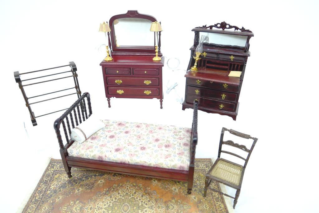 Dollhouse Commercial Bedroom Furniture: Double bed with mattress 6.5"L, carpet 6.5" by 10", dresser with mirror 3.75"W, slant lid writing desk with side chair, quilt rack, pair of electrified candlestick lamps, electrified fluid style lamp