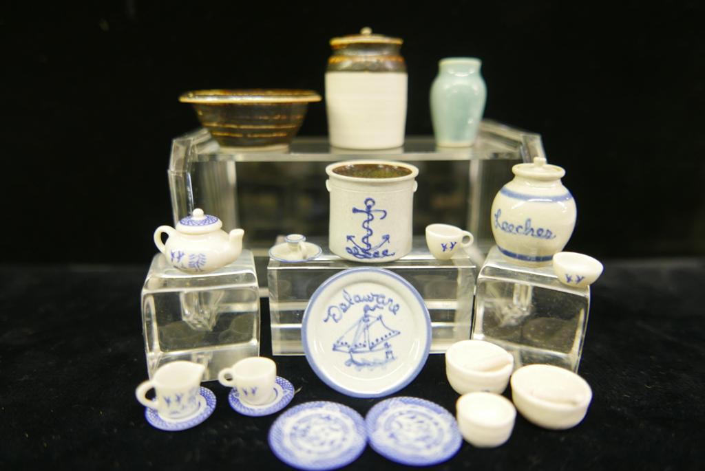 Dollhouse Artisan Ceramics: Vernon Pottery blue slip decorated crock, canister, chamber stick and Delaware plate 1.25"D, James Clark three mortars with two pestles, K.D. blue and white tea set, three pieces with unknown mark inc
