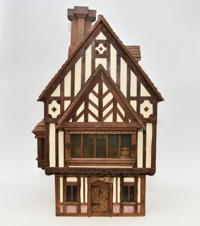 James Hemsley Drake Lodge Dollhouse: James Hemsley of Trigger Pond Cottage Oxfordshire England, Tudor style Drake Lodge, Dollhouse, hinged on front and back, detailed molded shingled roof, large removable fireplace top, concealed interio
