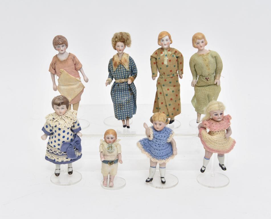 Eight Vintage Bisque Dollhouse Dolls: Antique jointed bisque girl doll with glass eyes, blonde wig and crochet dress 3.5"H, vintage bisque boy and two girls with original clothes, four vintage dollhouse bisque women dolls with worn origin
