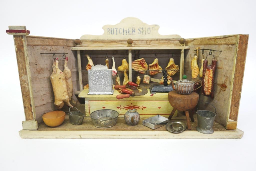Antique Butcher Shop Room Box Dollhouse: Early 20th century Butcher Shop loaded with original accessories, room box has original wallpaper and paper over wood flooring, 17.25"W, 8"D, 9.75"H, comes with a stenciled wood store counter, large s