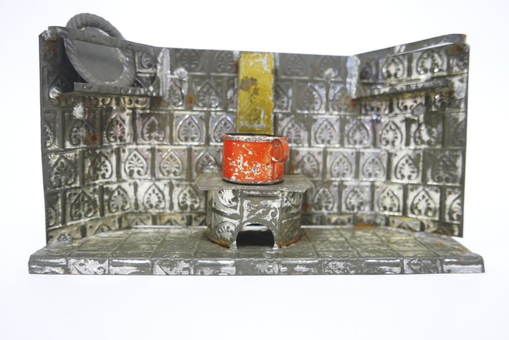 German Nuremberg Tin Kitchen: Antique German embossed tin kitchen circa late 1800's with built in stove and plate racks 9.5"W