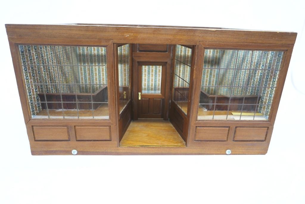 Dollhouse Store Room Box: Single room store room box, front has recessed opening door flanked by large display windows with raised platforms, interior has wallpaper and wood floor, removable roof for access 20.5"W, 15"D, 10.5"