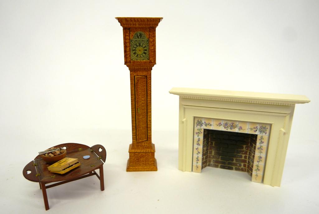 Therese Bahl Painted Tall Case Clock Miniatures: Therese Bahl grain painted This Xacto tall case clock with brass dial 7.25"H, Wink Knowles mahogany butler style coffee table, Braxton Payne fireplace mantel with tile lined insert 5.5"W, 4.25"H