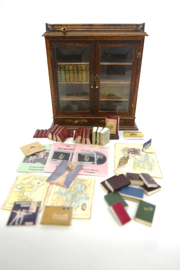 Artisan Mahogany Dollhouse Bookcase: Beautifully made Arts & Crafts Style two door bookcase with beveled glass doors, brass hinges and knobs, two drawers in base, top may be rosewood, signed "Hand Crafted" followed by illegible signature