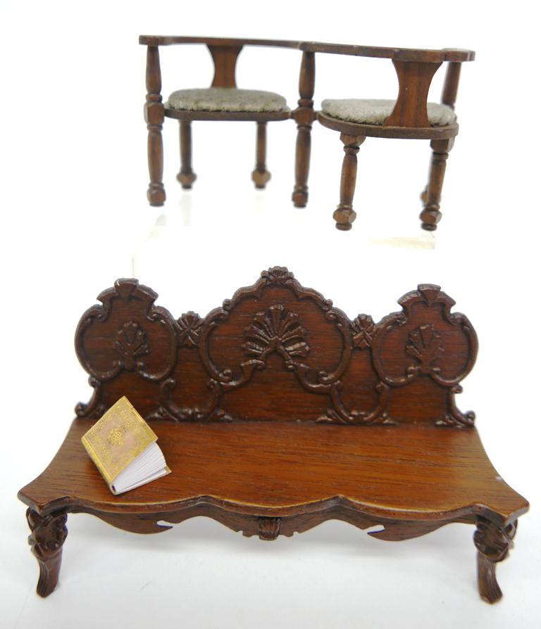 Spirek & Stockton Carved Dollhouse Seating: Dennis and Mary Spirek carved mahogany sofa 5.75"W, Mark and Sharon Stockton gossip bench 4 3/8"W