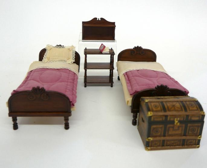 David Booth Dollhouse Beds & Others: Pair of David Booth mahogany carved beds 6"L, 3"W, Booth hanging mahogany wall shelf 2.5"W and bookcase 2 5/8"H, also includes a Hochradel paper covered dome top trunk, exterior trimmed in decorated p