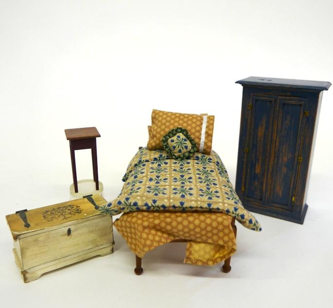 Joan Byer Dollhouse Painted Armoire & Others: Joan Byer of CJ's painted two door armoire with distressed paint finish 3.5"W, 6"H, also includes an unsigned walnut top side table with painted base 2.5"H and a Don Cnossen rope bed loaded with fabri
