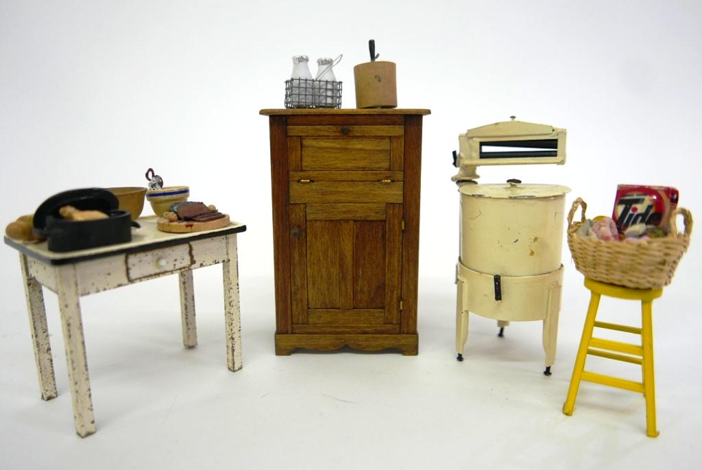 Laura Gill Dollhouse Ice Box & Table etc.: Laura Gill ice box with a nicely detailed interior 3"W, 4.5"H, Laura Gill kitchen table with a faux enamel top and distressed base 3"W, unsigned cast metal washing machine with wringer 4.5"H has worn