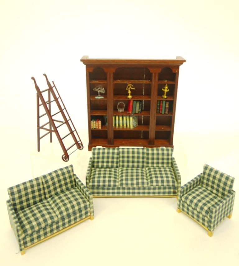 Paul Ki-Kydd Dollhouse Bookcase & Others: Paul Ki-Kydd mahogany bookcase 6.75"W, 6.75"H includes faux books and some small accessories, also includes a commercial three piece seating set with sofa 6"W, loveseat and armchair, library ladder on