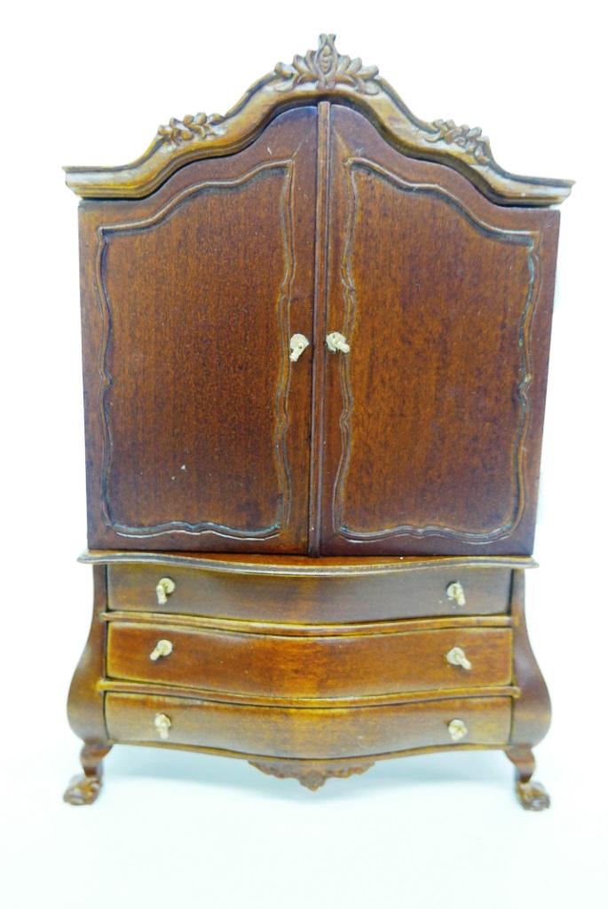 Dollhouse Lighted Armoire Dollhouse: Elsbeth Design Bombay style armoire has two hinged doors covering a nine room tiny dollhouse with electric lighting 5.25"W, 7.75"H, 1.75"D