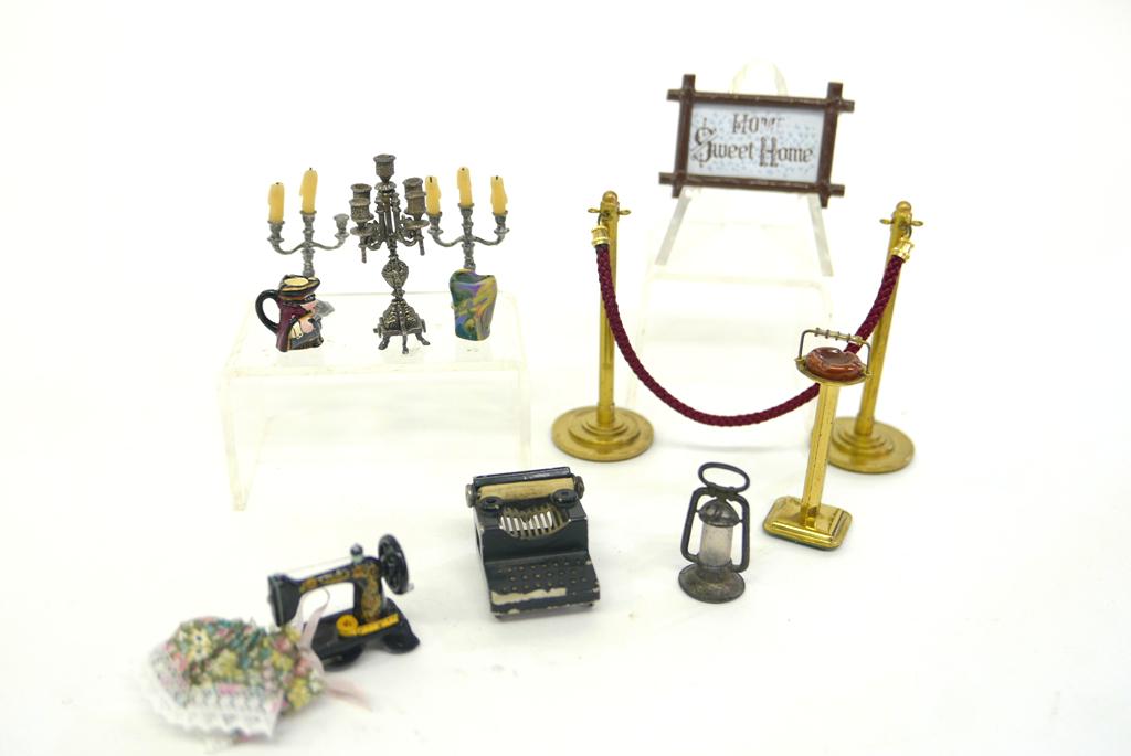 Stetkewizz Stanchions ll Metal Accessories: Sterling silver candelabra 2"H, brass posts with rope, Toby jug form ashtray from Trigger Pond Cottage England, pewter candelabras, vintage wall hanging, lantern and typewriter with paint loss, sewing
