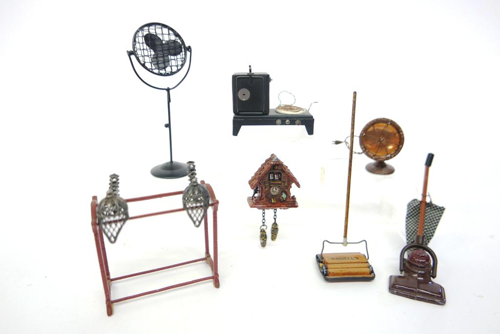 Small Dollhouse Assorted Accessories: Nicely detailed artisan hotplate 2"W, electric fan and heater, floor sweeper, resin cuckoo clock, vintage English cast metal vacuum cleaner, painted metal quilt rack etc.