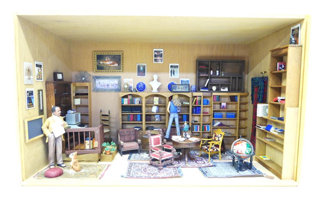 Book Store Dollhouse Room Box: Plywood room box book store with removable front Plexiglas panel, attached bookcases on three walls, raised platform with cash register and computer, nice assortment of faux paper books and solid wood