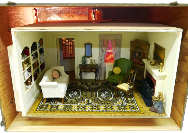 Fully Furnished Tradiional Living Room Box: Well made plywood room box within a larger wood box, front frame with glass unscrews for access, electric lighting includes ceiling dome light, fireplace logs, back lighted window with garden scene an