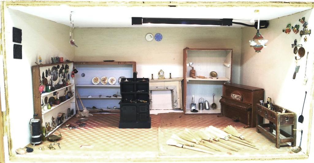 Store Room Box With Accessories Dollhouse: Plywood store room box with hinged front door and built in ceiling lighting, contains a wood fireplace and an assortment of wood cigar box shelving, older spinet piano and counter, newer commercial wo