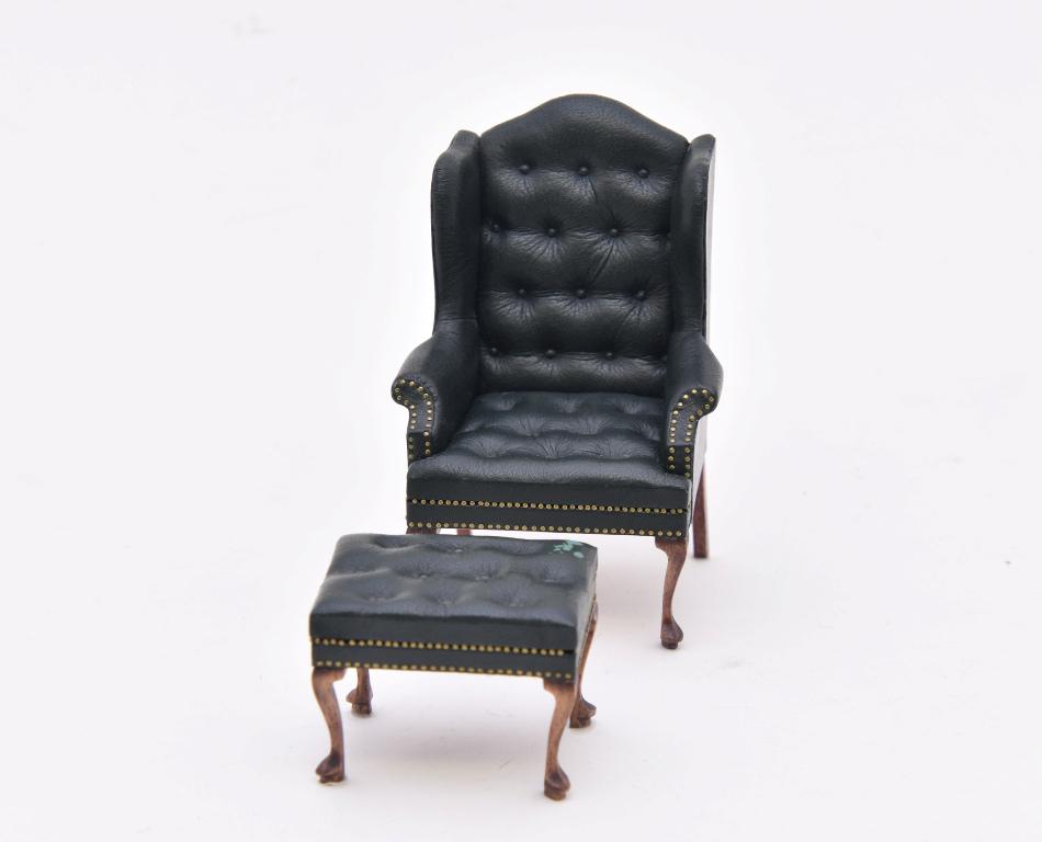 Gail Steffey Wing Chair & Ottoman Miniatures: Gail Steffey Queen Ann style leather wing chair 3.75"H with matching ottoman, button tufted leather with tiny brass nail trim