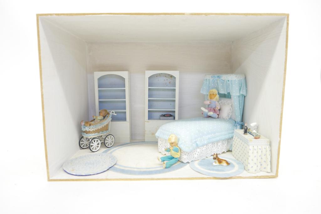 Girl's Bedroom Dollhouse Room Box: Wood room box with painted interior contains three cloth head dolls, d Anne Ruff dressing table with accessories, commercial bed and wood bookcases, three rugs, commercial pram decorated by P. McClusk
