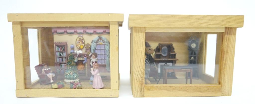 Two Furnished 1/2" Scale Room Boxes: Wood room box with removable top and front containing a Maude Humphrey Bogart cast resin fireplace wall, resin tree, figures and presents 7"W, 5.5"D, 5.5"H, wood room box of similar construction conta