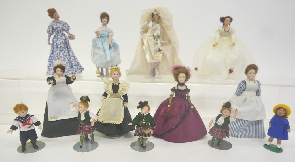 Thirteen Bisque Dollhouse Dolls: Group of 13 all bisque dollhouse dolls includes two brides in elaborate gowns, woman serving tea and five other women tallest 6", three Scottish children, boy in a sailor suit 3 1/8"H and a bisque com