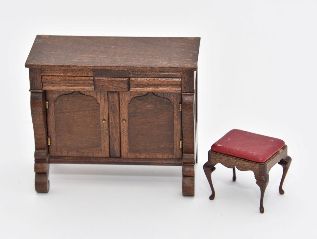 Gutheil Sideboard & Stool Dollhouse Miniatures: Roger Gutheil mahogany Empire style sideboard with raised arched panels on doors 4 1/8"W, 2"D, 3.5"H, Gutheil mahogany stool with leather top, scalloped skirt and cabriole legs 1 5/8"