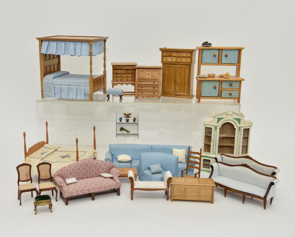 Large Lot Of Commercial Dollhouse Furniture: Lot includes a canopy bed 7"L, 5.75"W, high post bed needs one leg reattached, blue three section sofa, armoire, desk, blanket chest, pair of matching sofas 7"L, upholstered bench and stool, rocking c