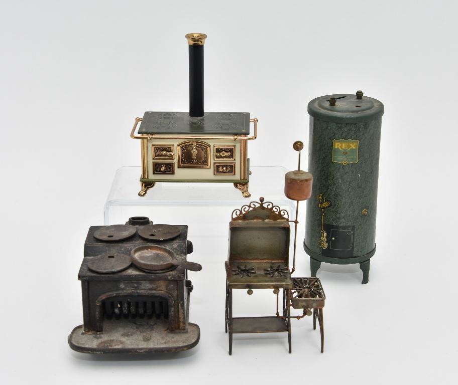 Unusual Dollhouse Kitchen Appliances Miniatures: Vintage Cleveland Heater Company lithographed tin furnace coin bank 7.25"H, antique cast iron stove with original paint missing small side door 4.5"W, hand made metal gas stove with lots of intricate
