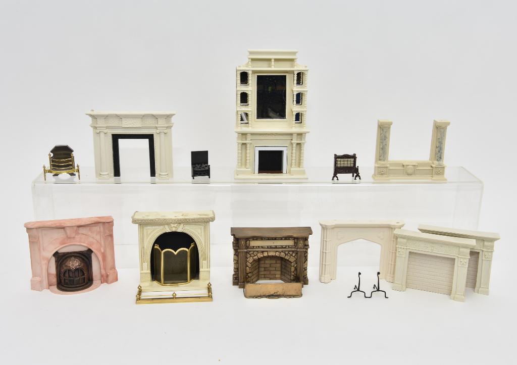 Assorted Dollhouse Fireplace Mantels: Cast resin and plaster dollhouse fireplace mantels in an assortment of styles, largest is 5"W by 8.5"H, antique brass fender 3.5"W, modern quality solid brass fender 4.75"W and firebox 2.25"W, metal c