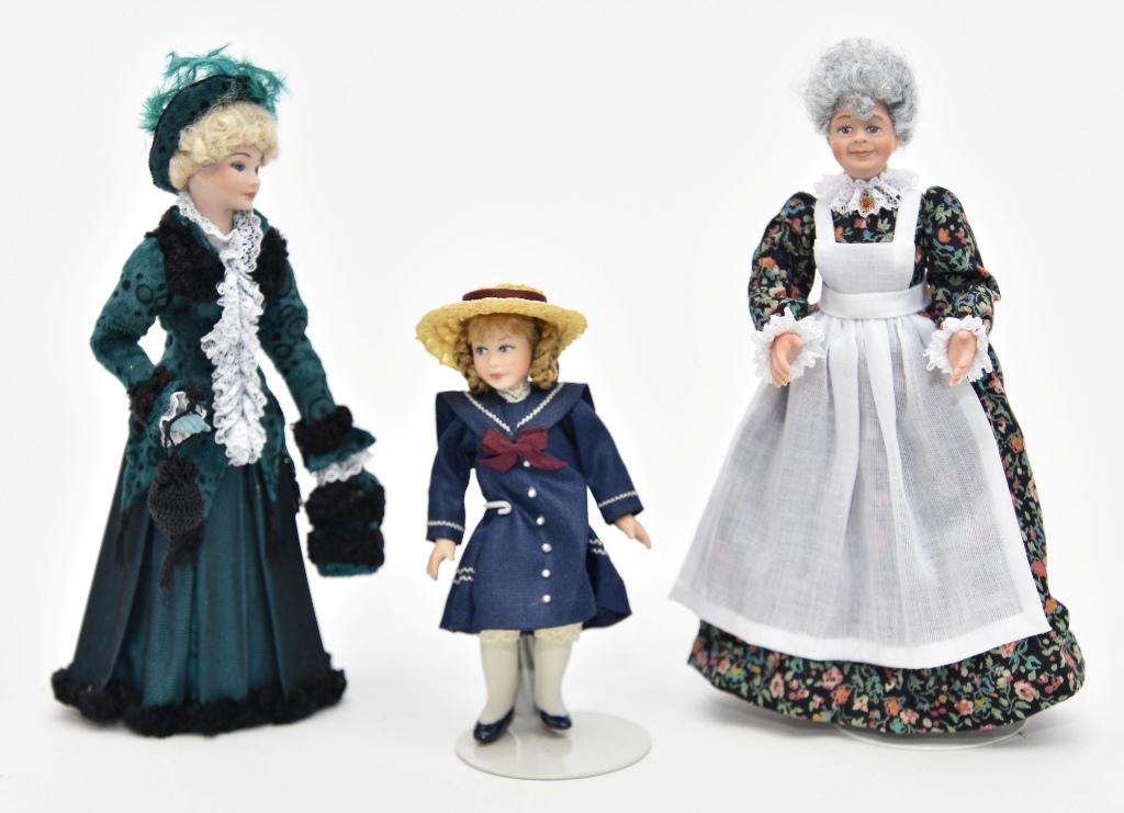Three Rae Lynn Artisan Dollhouse Dolls: Three Rae Lynn artisan bisque dolls, Victorian lady wearing a velvet coat trimmed with black lamb's wool and lace and a matching hat with feathers, dark green dress and purse trimmed with lamb's wool 