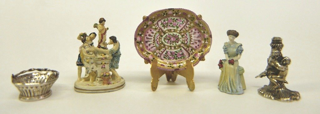 Acquisto, Sterling & Skinner &Olszewski Miniatures: Acquisto sterling silver embracing Putti form candlestick .75"H, sterling silver bread basket with twist swing arm handle has English hallmarks 9/16"D, Olszewski seated maiden 7/8"H and Olszewski figu