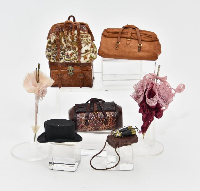 Dollhouse Luggage & Accessories Miniatures: Selection of 1/12" scale artisan accessories, leather duffle bag signed [LJB?] 2.25"L, carpet bag with leather trim attached to top of leather trunk 2"W, carpet bag with leather trim 2"L, leather case
