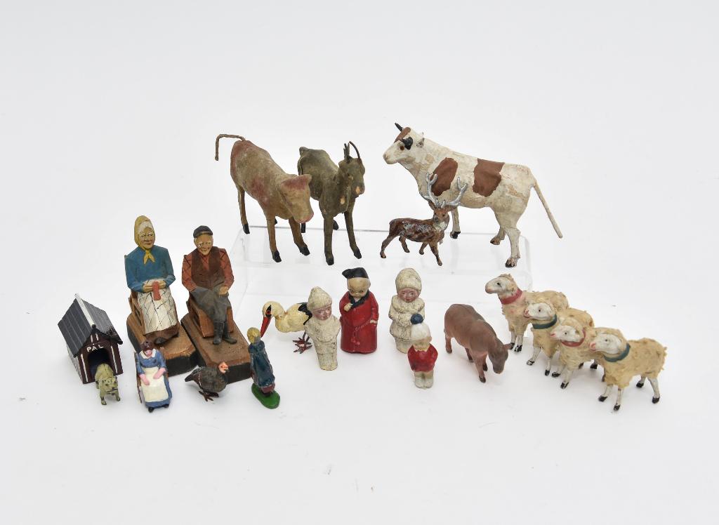 Antique German Miniature Animals & Figures: Antique German composition cow with wood legs 3.75"L, goat, four flocked sheep and a bull with damaged leg stamped Germany, carved wood man and woman in rocking chairs 3.5"H, two bisque snow babies, b