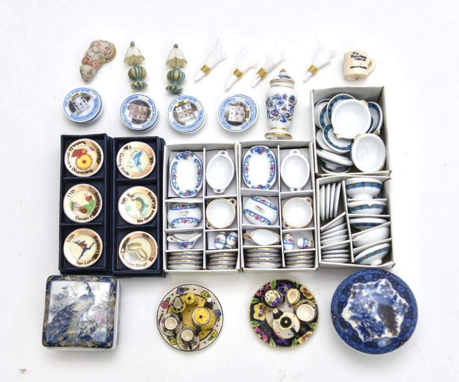 Dollhouse Commercial China & Porcelain Accessories: Boxed set of six Christmas plates, four sets of dishes in original packaging, two painted bisque tea sets of trays 1 5/8"D, Reutter covered urn, The Dolls House Emporium set of 12 monthly calendar pla