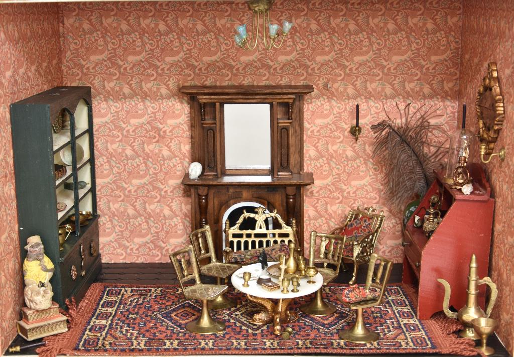 Furnished Living Room Box Dollhouse: Small wood room box has papered walls and plastic tile on floor, contents include a large wood fireplace with mirror, large bookcase filled with small accessories, four brass chairs, round marble top 