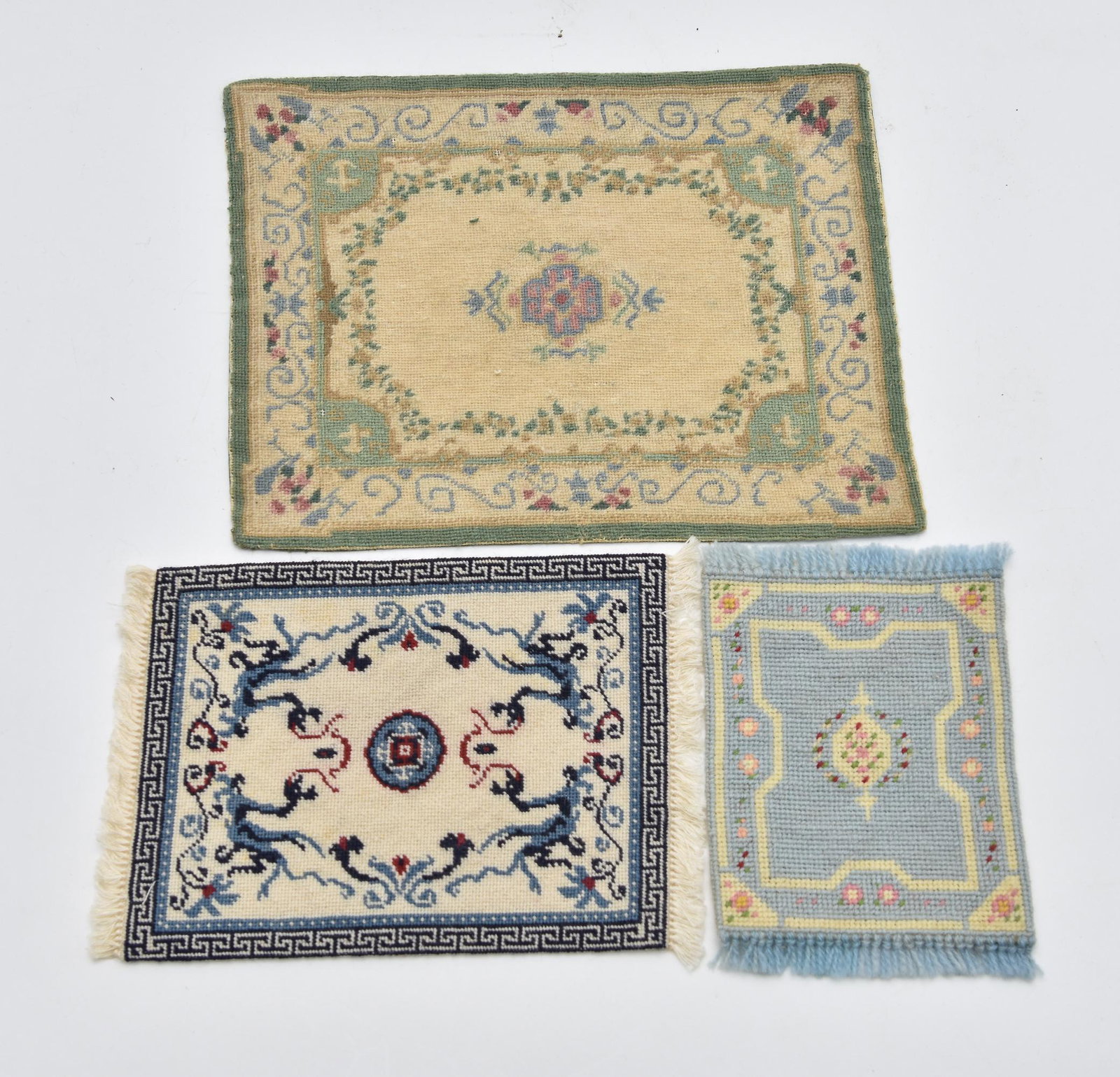 Three Dollhouse Needlepoint Miniature Carpets: Virginia Moseley hand made needlepoint Chinese style carpet 6.75" by 10" has foxing on back, Aubusson style needlepoint rug 9" by 12", pale blue needlepoint rug 5" by 7.5"