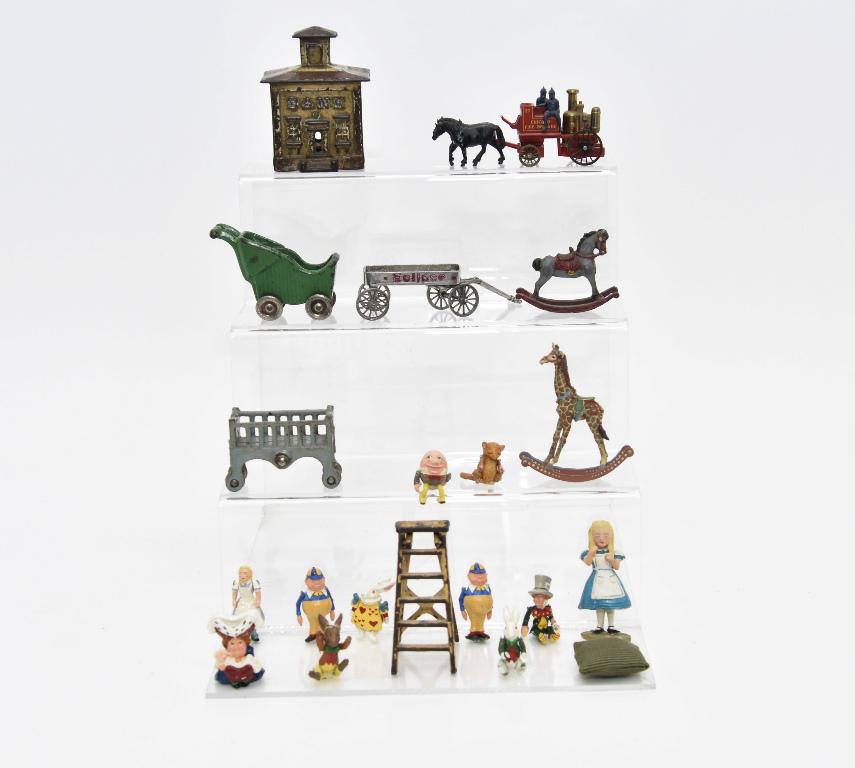 Hantel & Other Small Metal Miniatures: Group of Hantel hand painted cast metal figures from Alice In Wonderland including Alice 2.5"H and ten other figures, also includes a cast metal rocking horse and rocking giraffe 3"H, English die-cast