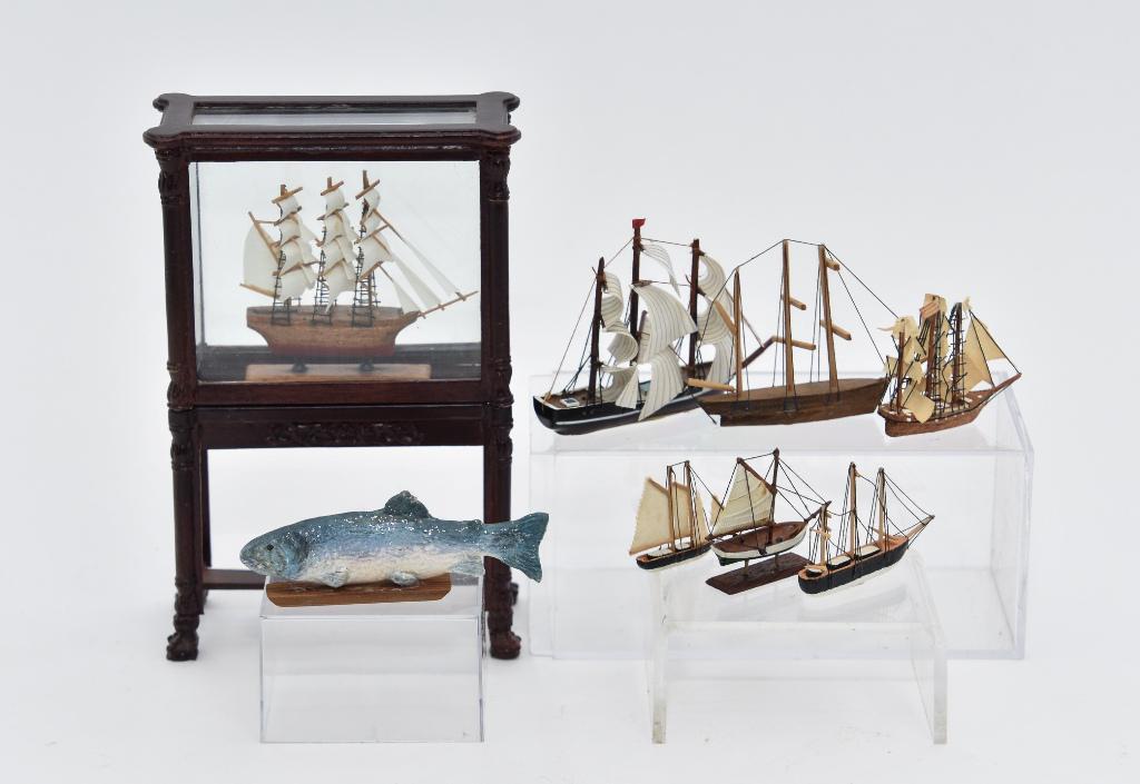 Bespaq Cased Ship Model & Others: Bespaq display case on stand with a wood ship model 3.5"W, 1.5"D, 5.5"H, six small ship models, cast resin fish 3"L