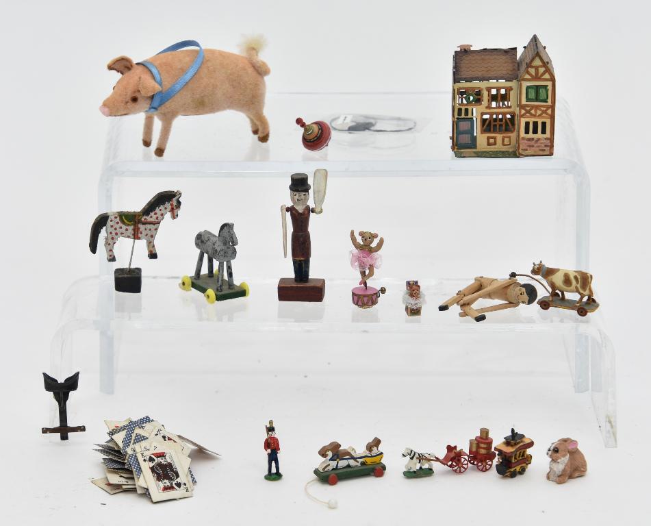 Renee Bowen & Others Miniature Toys: Renee Bowen painted wood horse pull toy 1.25"H, whirligig 2.25"H and jointed wood doll 2.25"H, joni horse on stand 1 5/8"H, unsigned rabbit and cow pull toys, Karen Phillips rabbit, metal horse drawn