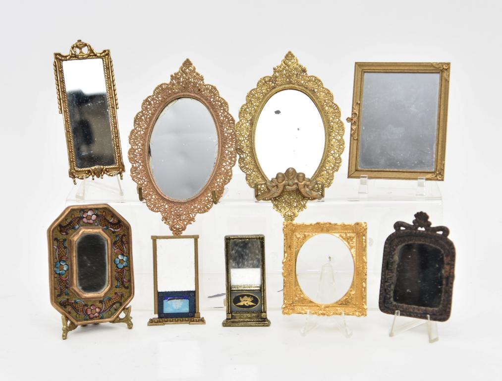 Assorted Dollhouse Mirror Miniatures: Antique cast iron mirror with shell finial has a patent date of 1867 3.5"H, unsigned John Hodgson quality solid brass frame with oval opening 2.75" by 3.25", pair of vintage brass colored oval pierced